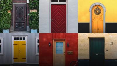 A grid of many doors, different colors and styles