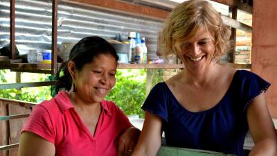 Jo Ann Van Engen '86 working alongside a woman in Honduras.