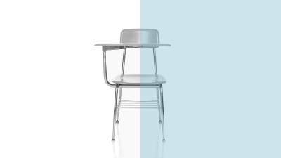 A classroom chair set against a white backdrop.