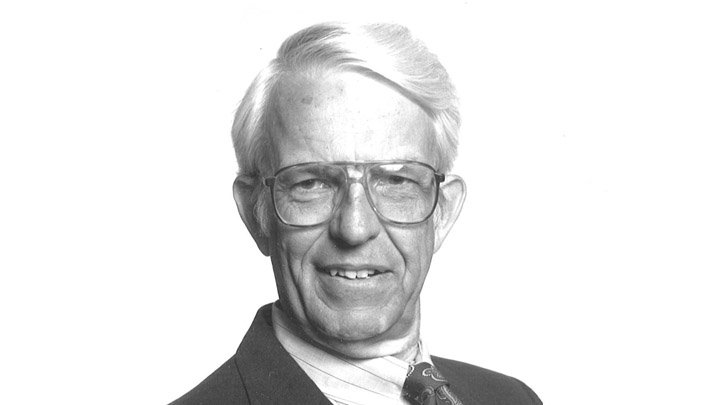 A formal headshot of Calvin professor emeritus Al Bratt