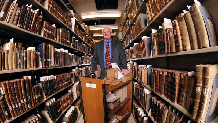 A fisheye view of Lugene Schemper, theological librarian, in the Hekman library.