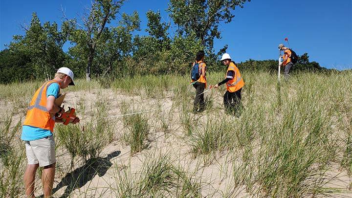 Students conducting research on Lake Michigan Dunes