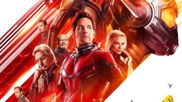 Ant-man stands, victorious, with the Wasp by his side. He is dressed in a red power suit.