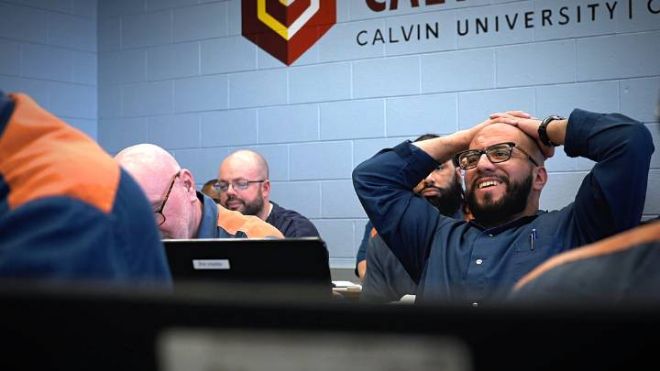 Students in the Calvin Prison Initiative program taking part in a class inside one of the Calvin classrooms at Handlon Correctional Facility in Ionia, Michigan.