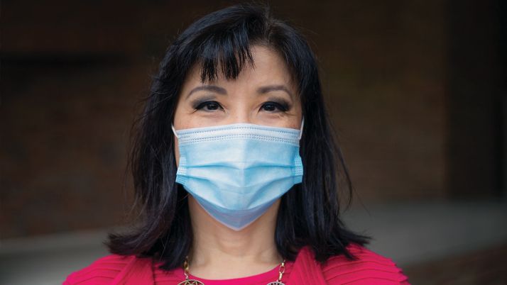 Calvin University professor Pearl Shangkuan wearing a surgical mask