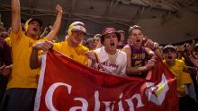 Calvin students cheering at a basketball game