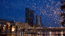 The Grand Rapids city skyline at night filled with lanterns from ArtPrize.
