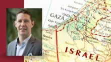 A man in suit coat's headshot inset over a map of Israel