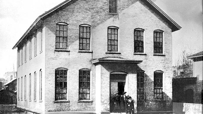 Calvin's first school building founded in 1876.