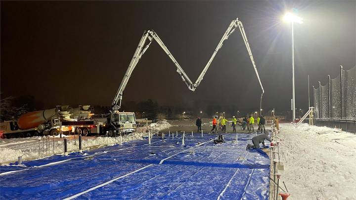 A team pours the concrete foundation for Calvin's new soccer and football buildings.