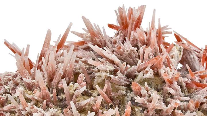 Red, white, and pink crystals with needle-like form.