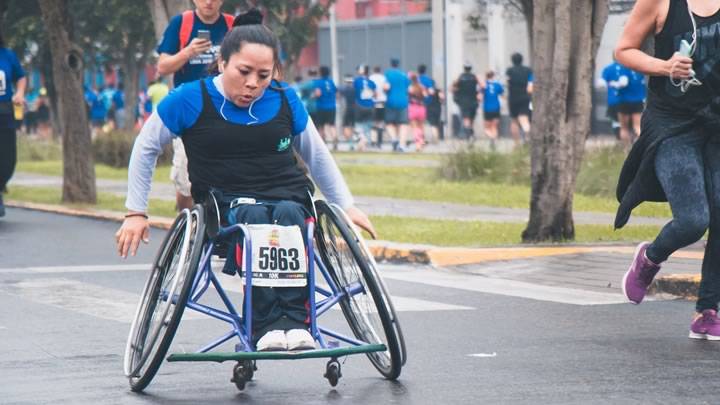 A person in a wheelchair, participating in a race