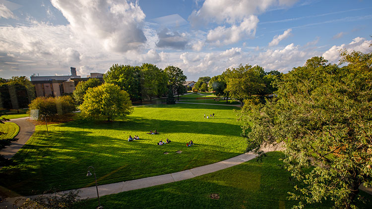 A beautiful day unfolds over the Commons Lawn at Calvin University.