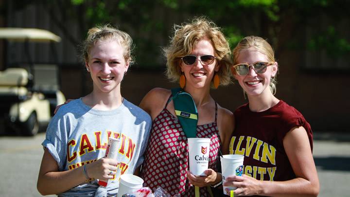Two young women and their mother wearing Calvin t-shirts