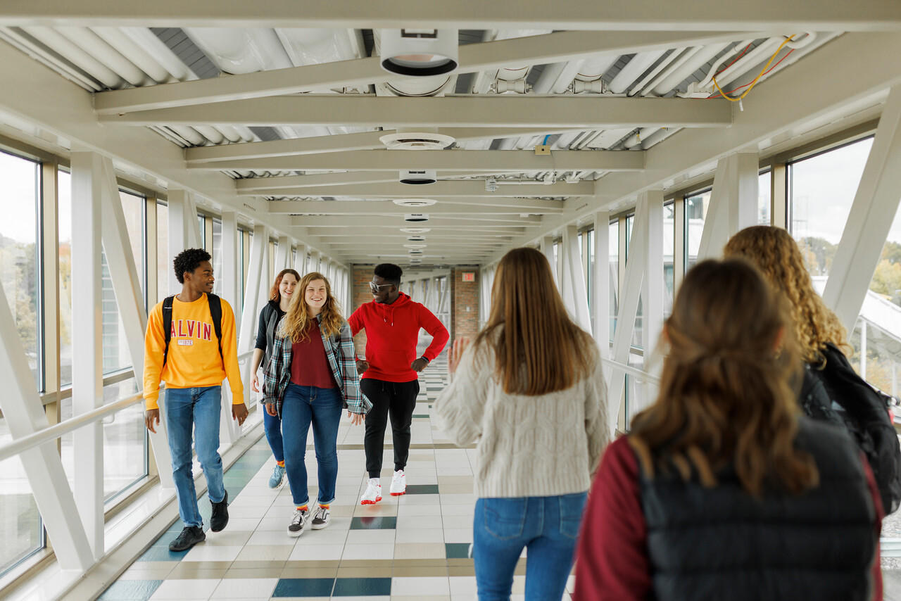 Calvin students walking over Calvin's Crossing