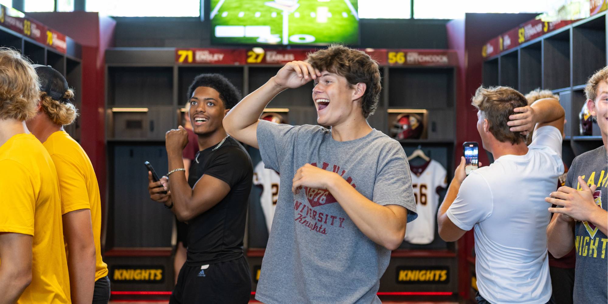 Players look shocked and excited, looking around at the new Calvin locker room.