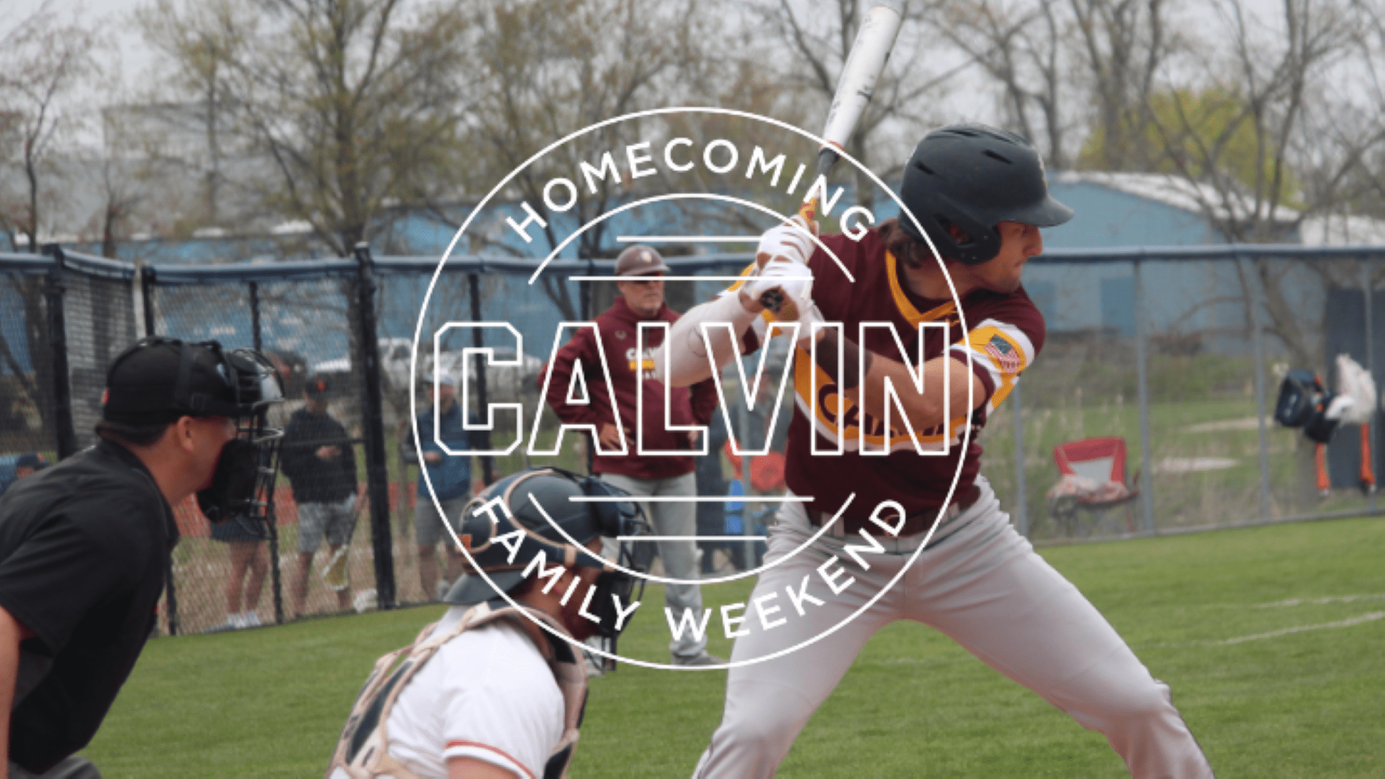 Calvin University baseball player holding a bat