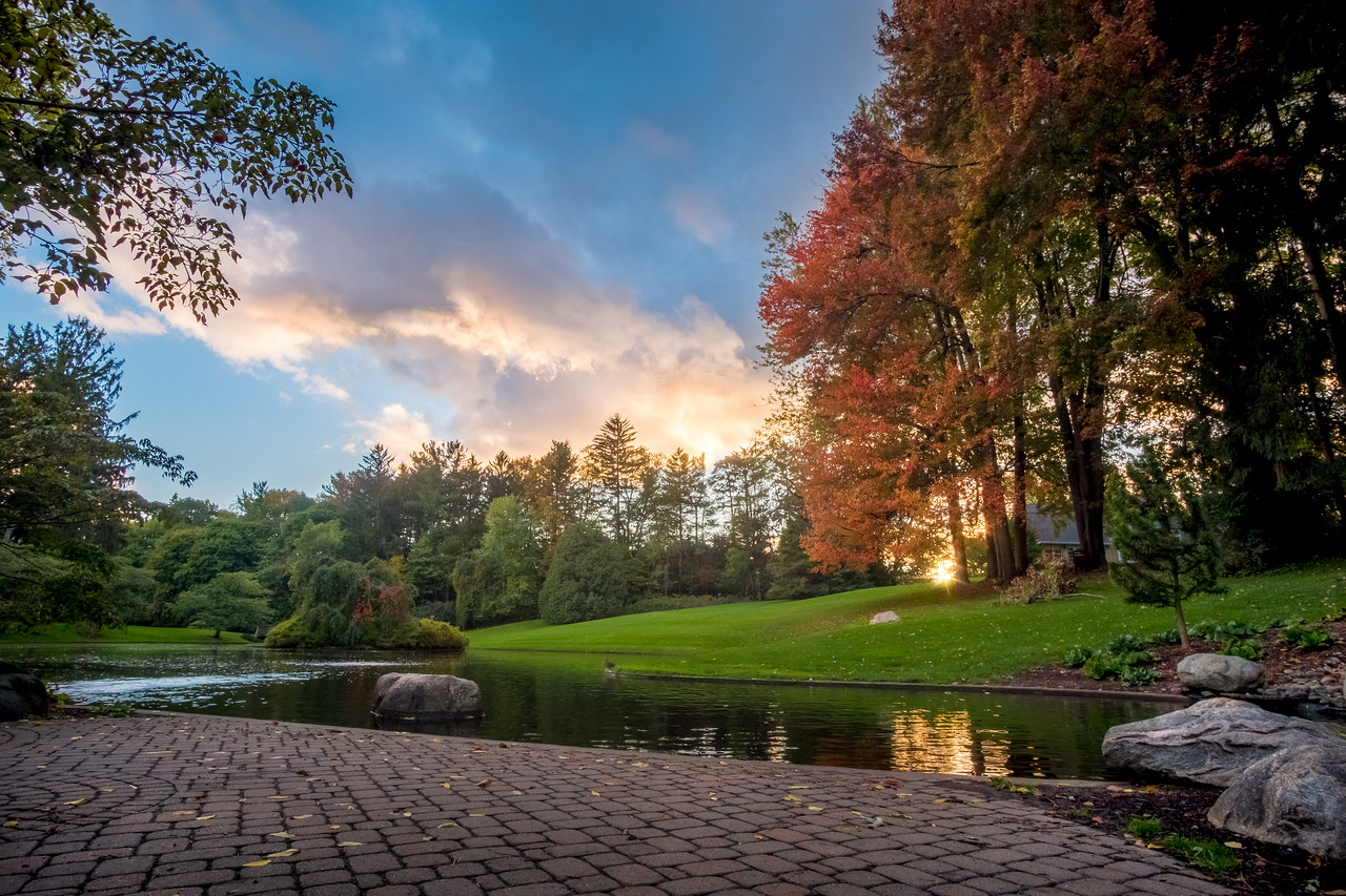 Calvin University Seminary Pond with fall colors and sunset through clouds