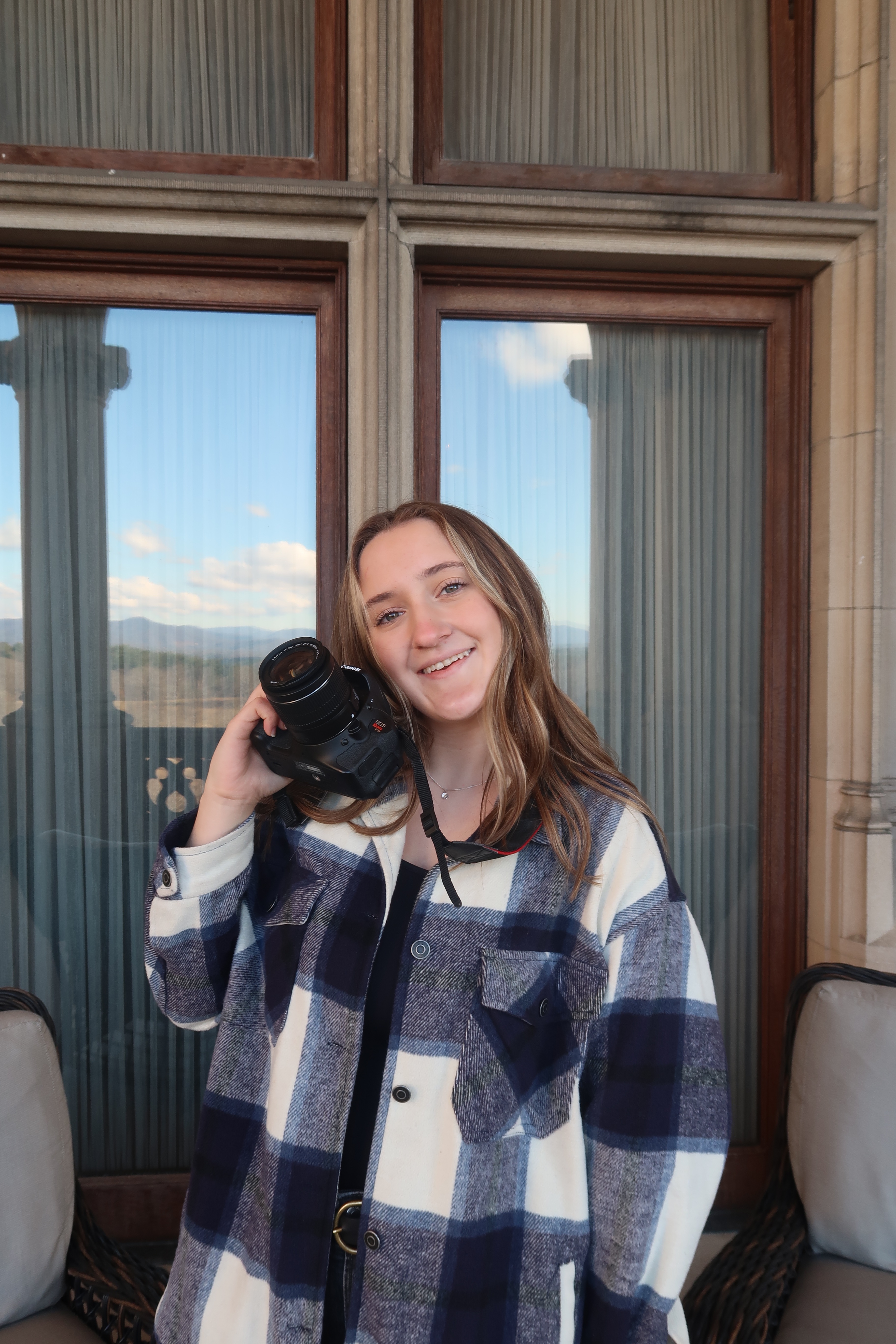 Madison Coleman poses with her camera.