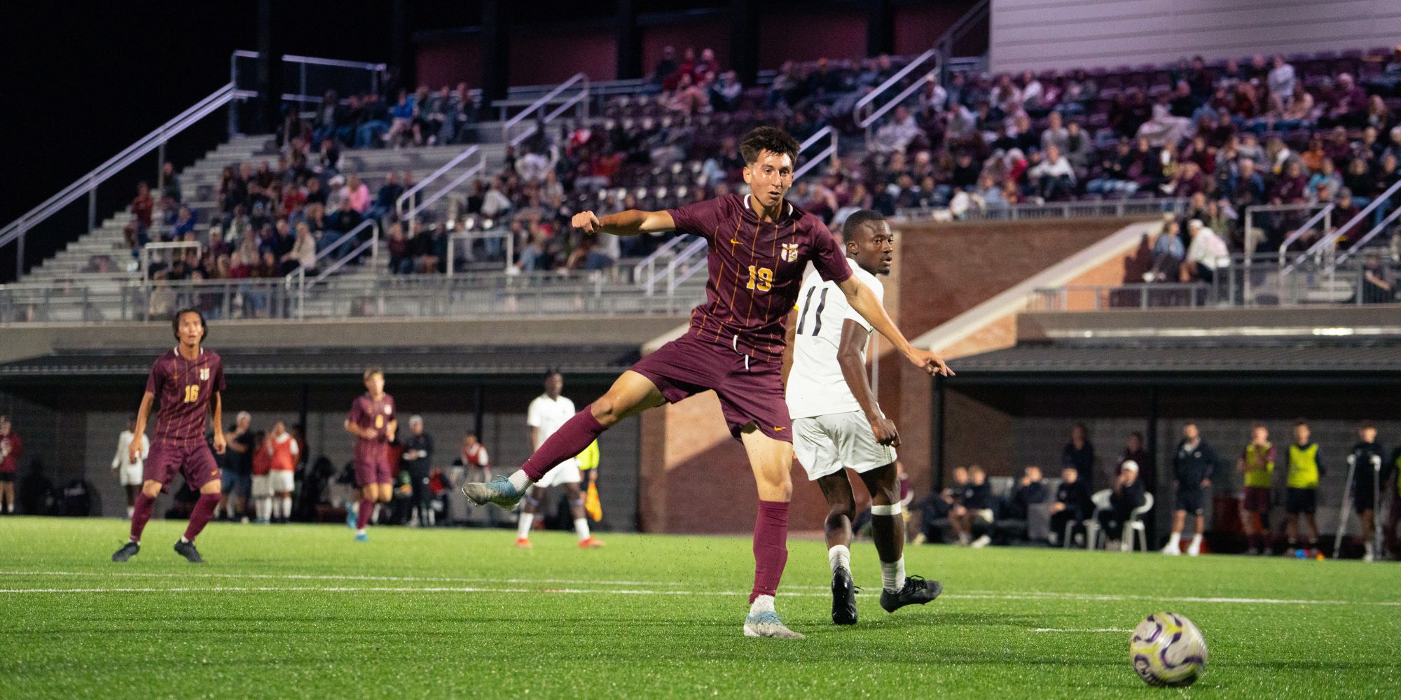 Calvin men's soccer team playing in new stadium.