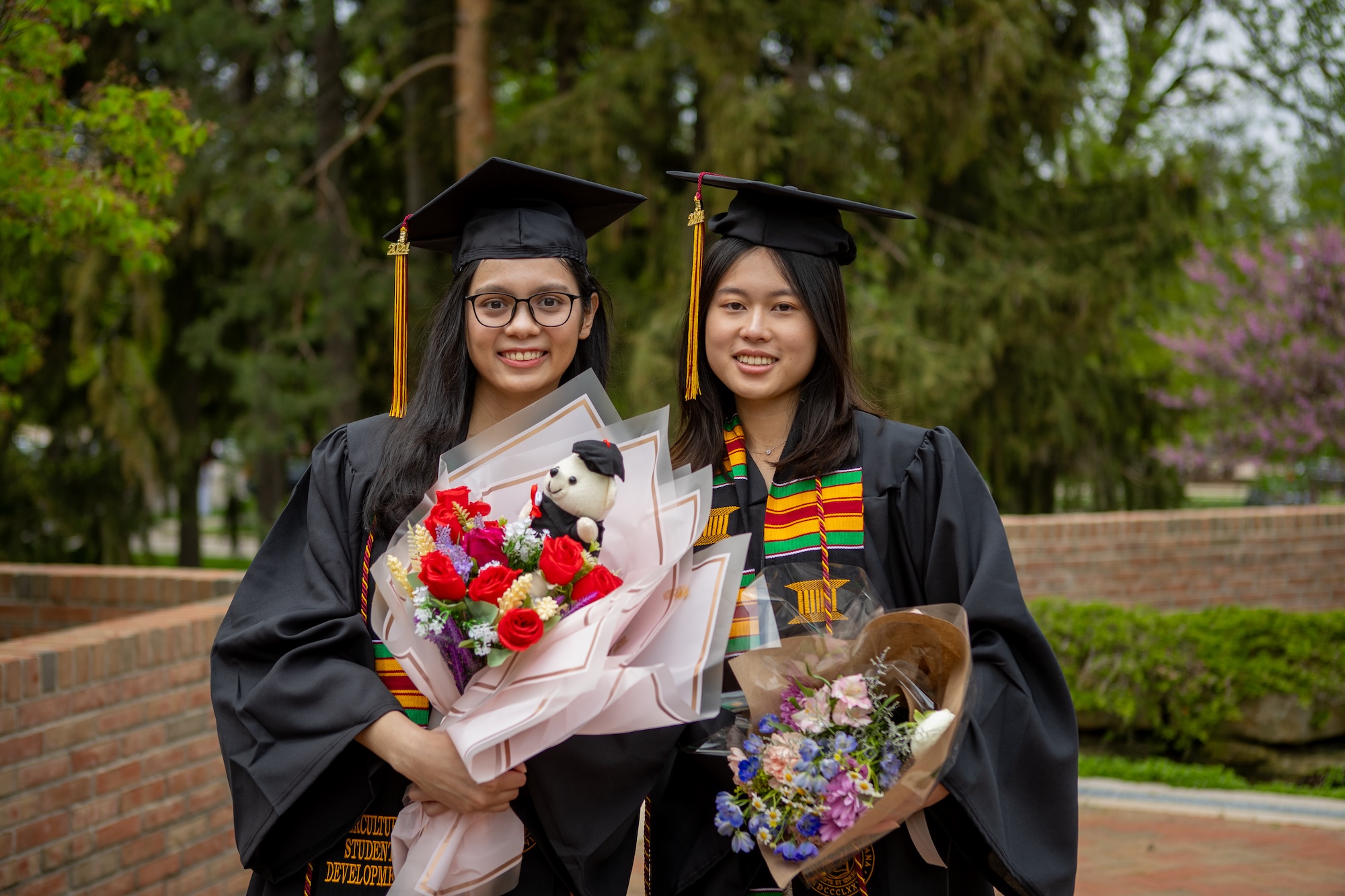 Smiling graduates from the Class of 2024 at Calvin University