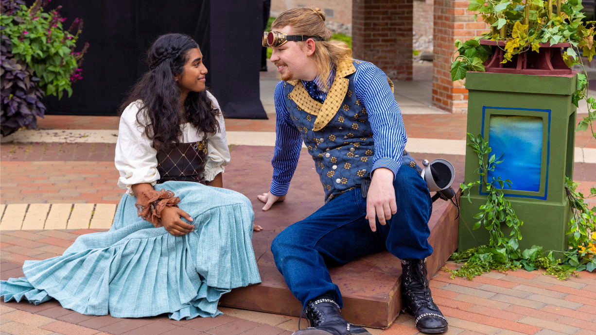 two students in a theatre production