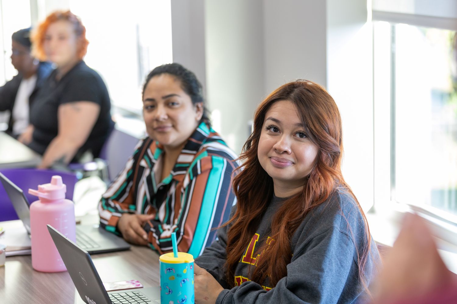 Woman seated at a table
