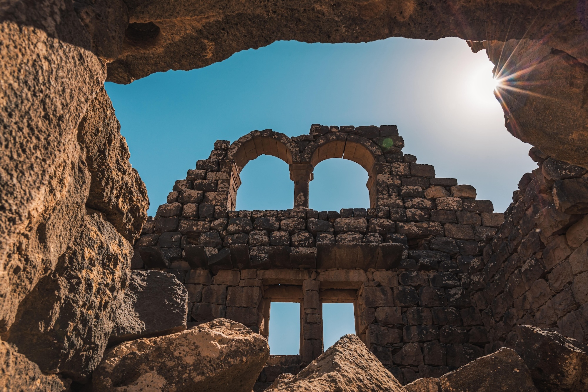 Sun shining through archeological site, Umm Al-Jimal, Jordan