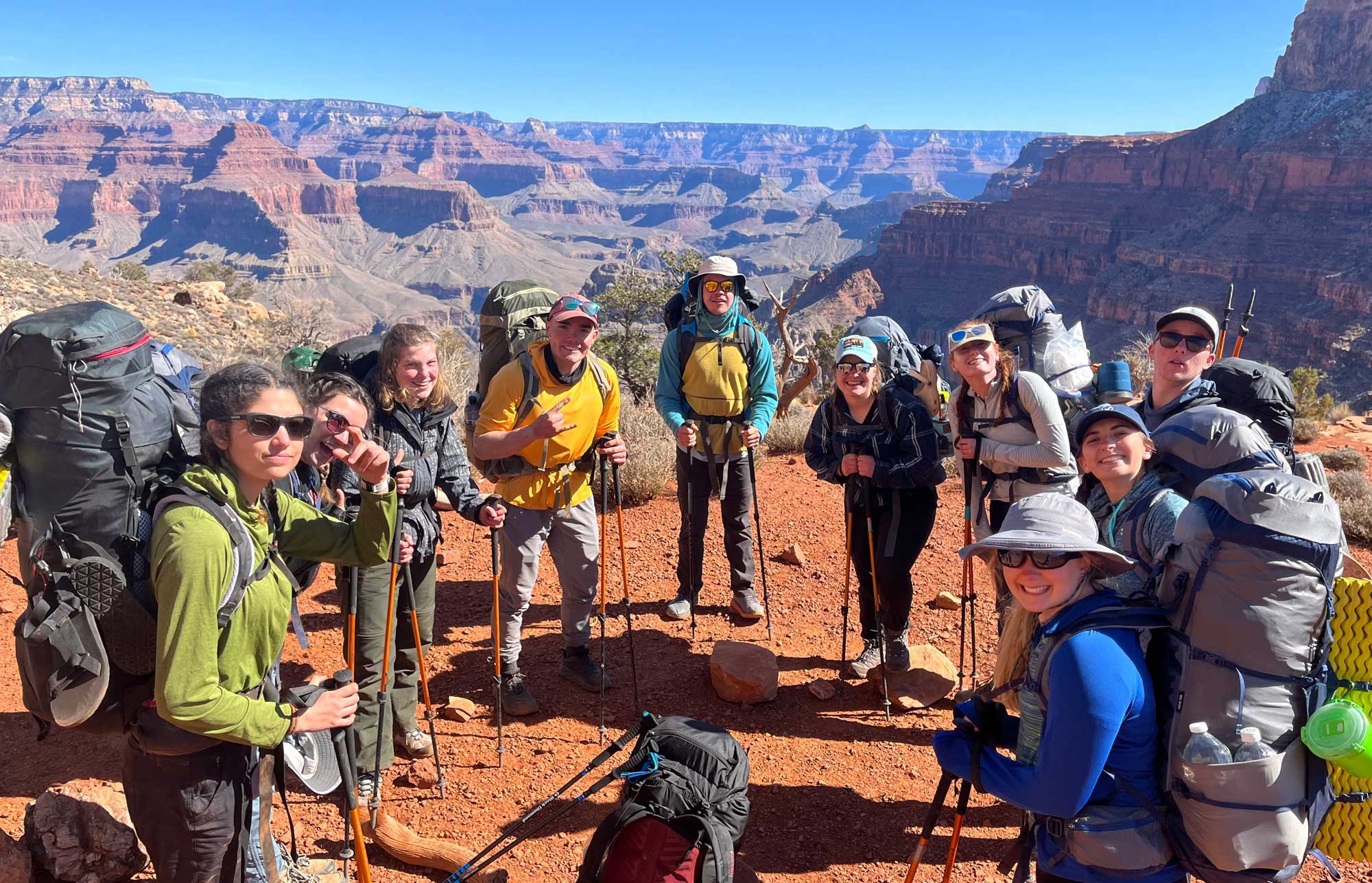 A group of students backpacking on a ridge in the Grand Canyon.