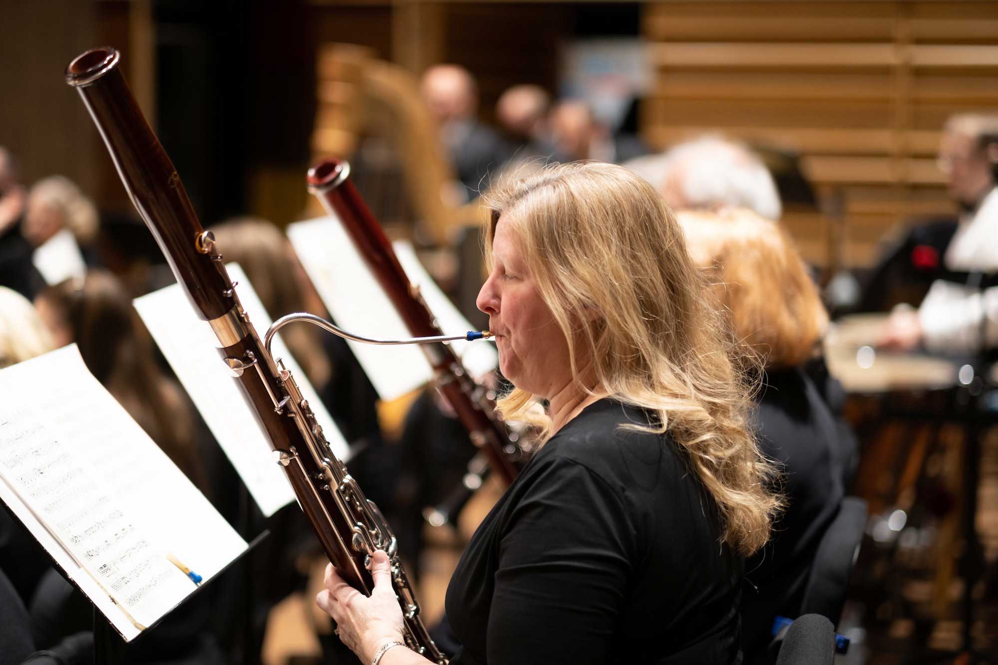 A woman plays the basoon in the Calvin University Symphony.