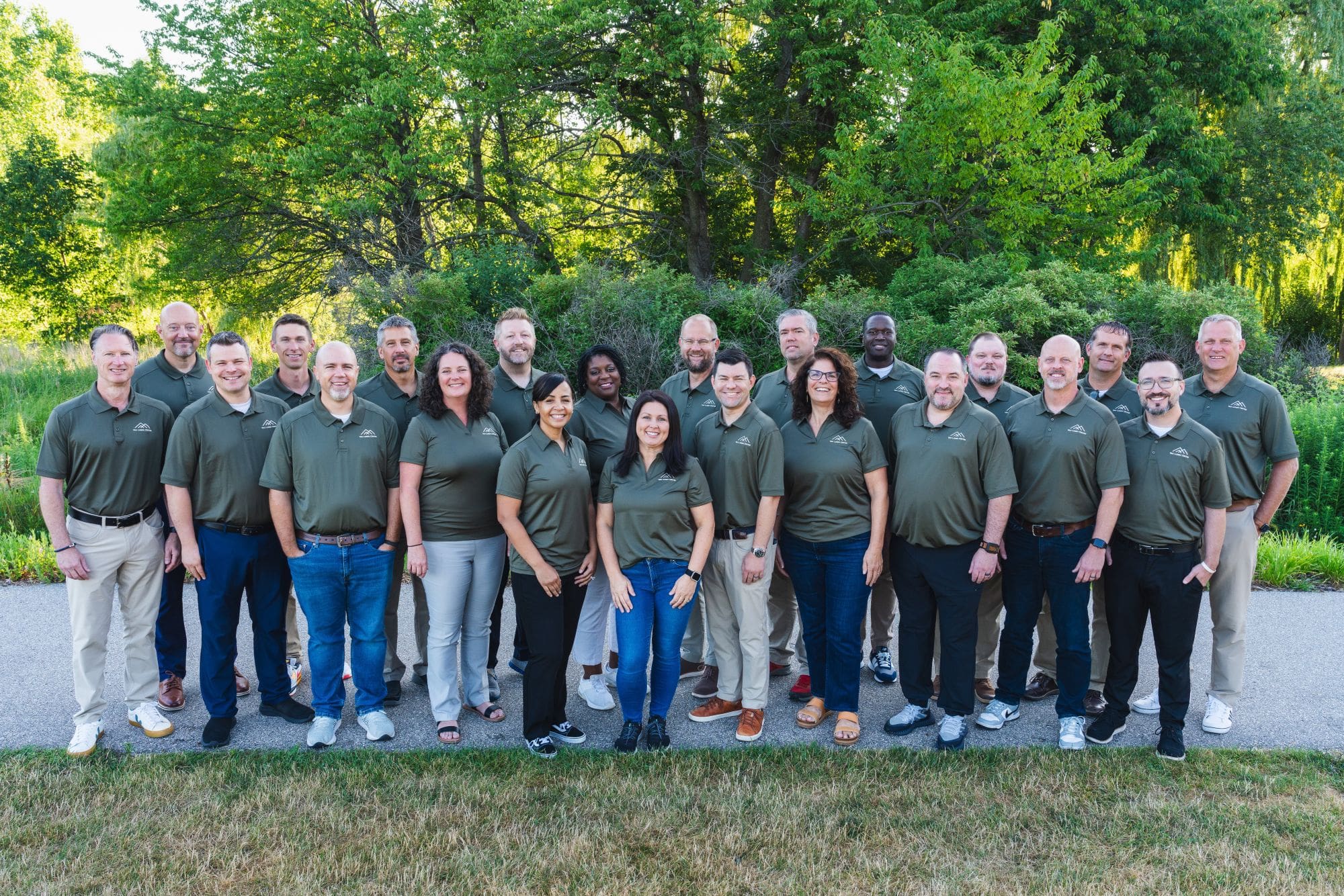 A student in a maroon lab coat works in a chemistry lab.