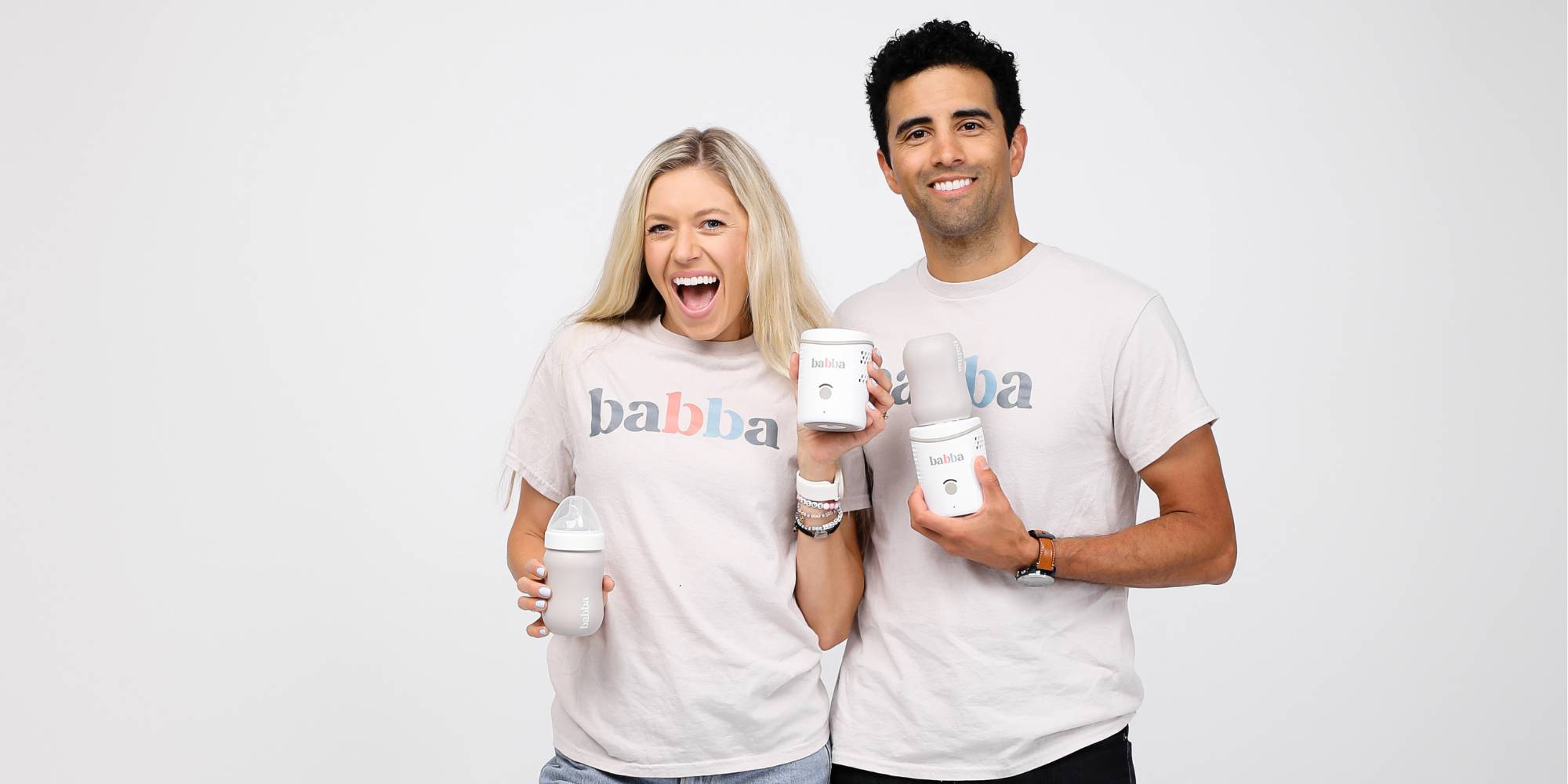 Dan Evans and his wife holding the Babba baby cooler and warmer.