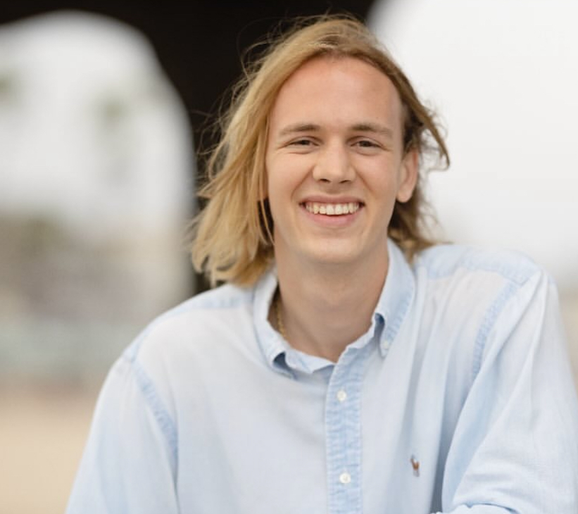 Guy similing in light blue shirt