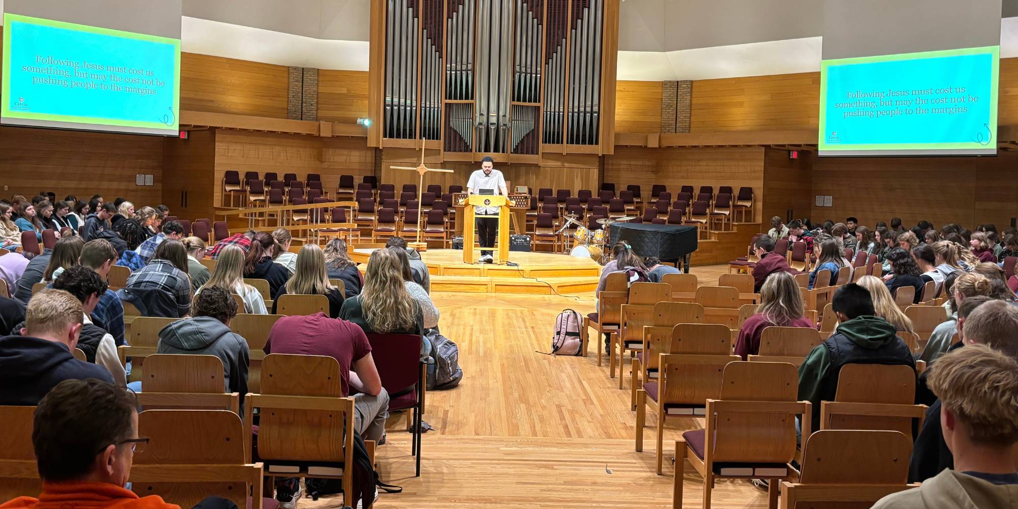 Josh Samarco prays during UnLearn Week chapel.