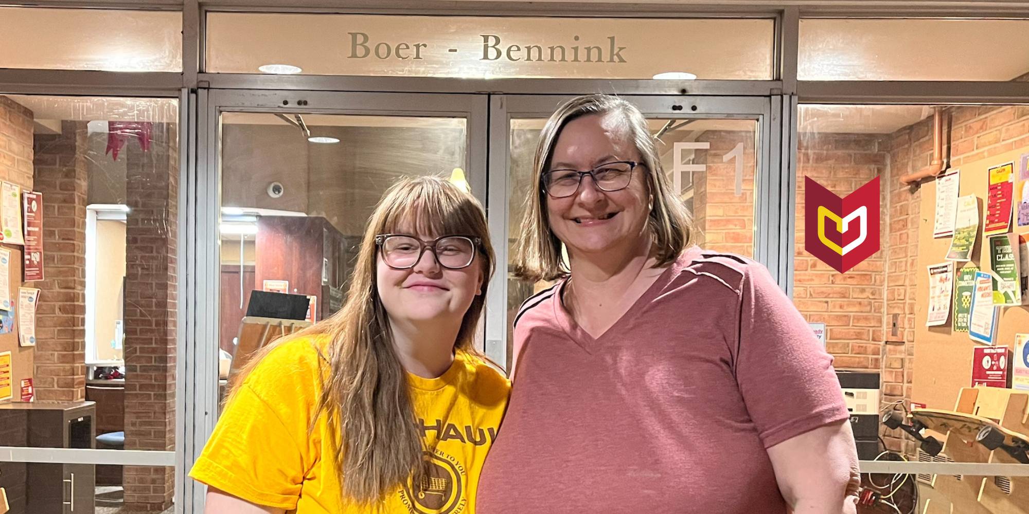 Abigail and Vicki Girard standing outside one of Calvin's residence halls.