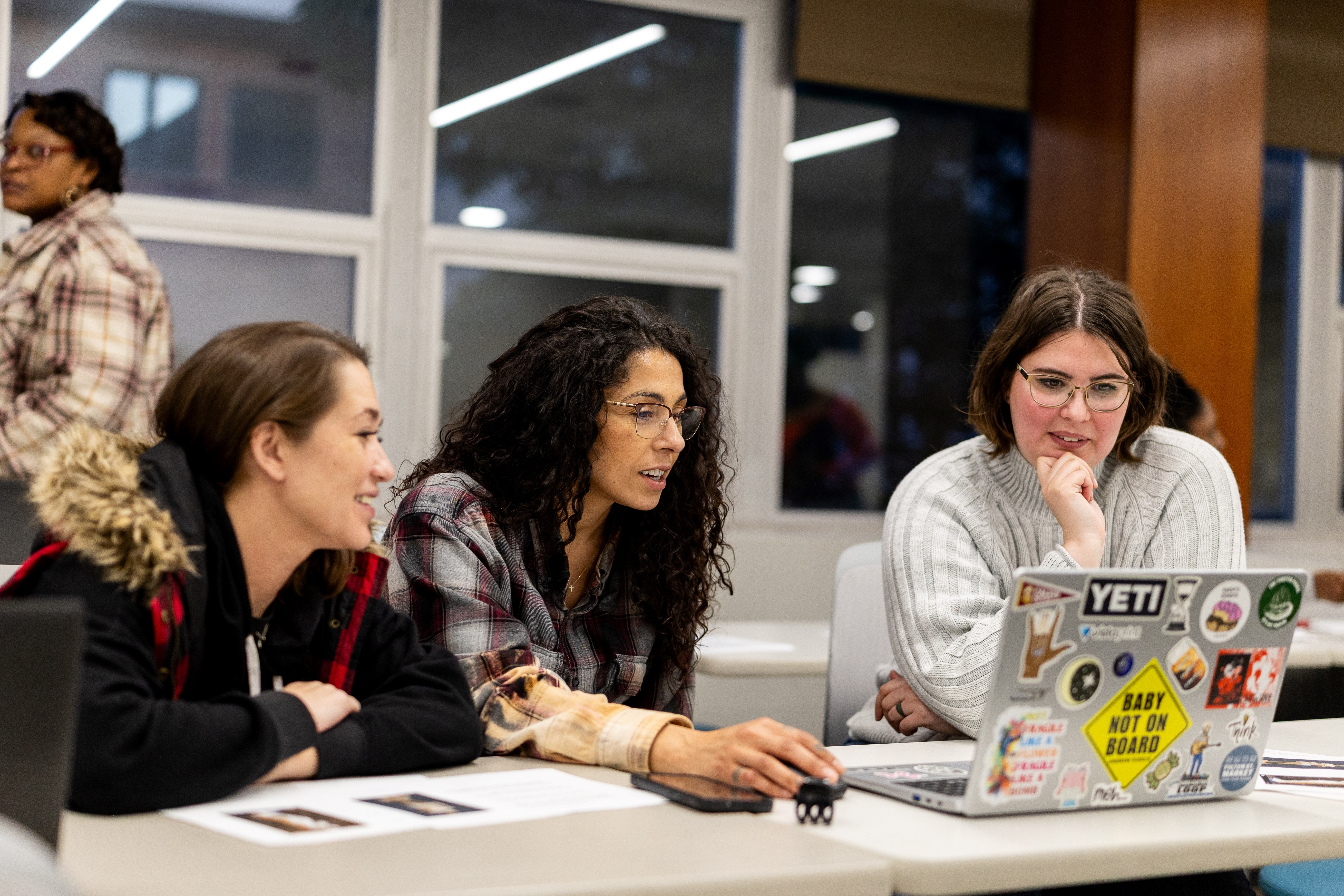Women working together in a classroom