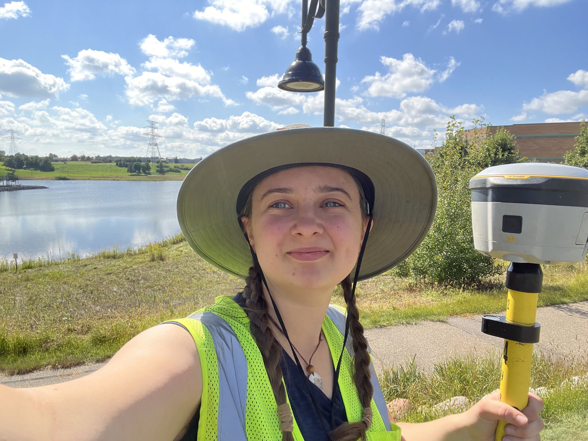 Abby Gustafson - a Calvin alumna - working on a site as a GIS technician