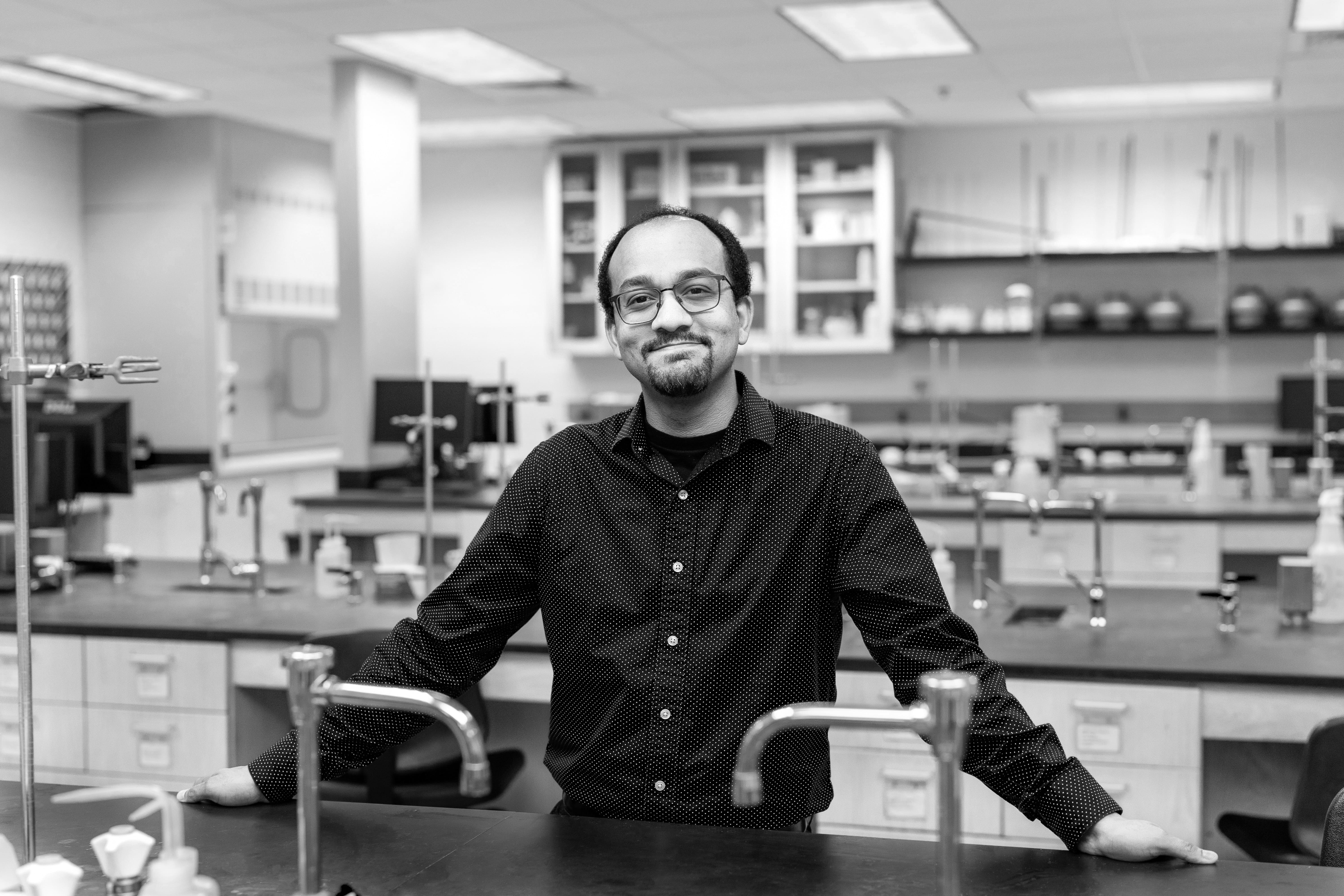 Kwabena Bediako standing in chemistry lab