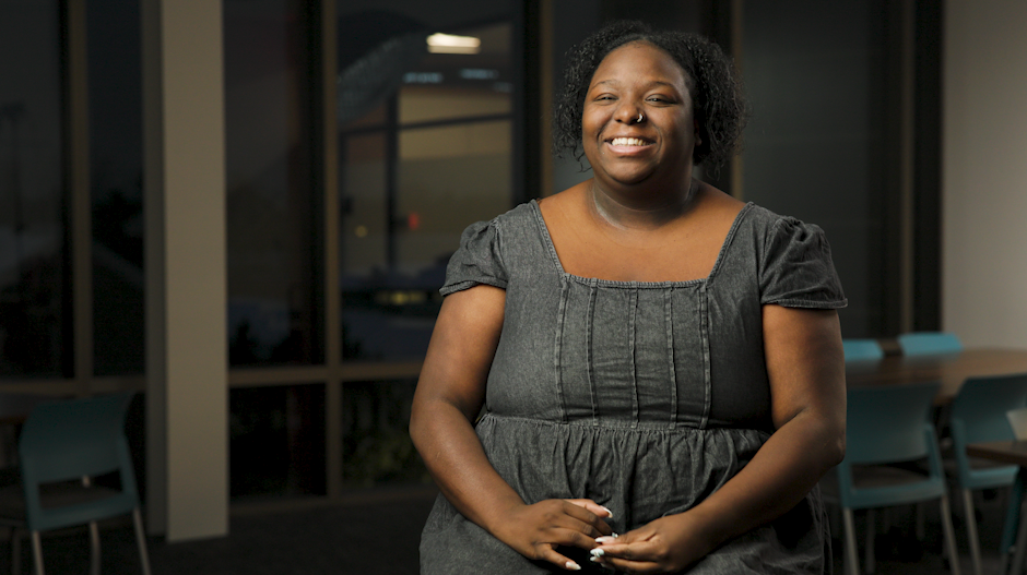 Panecia smiling at the camera