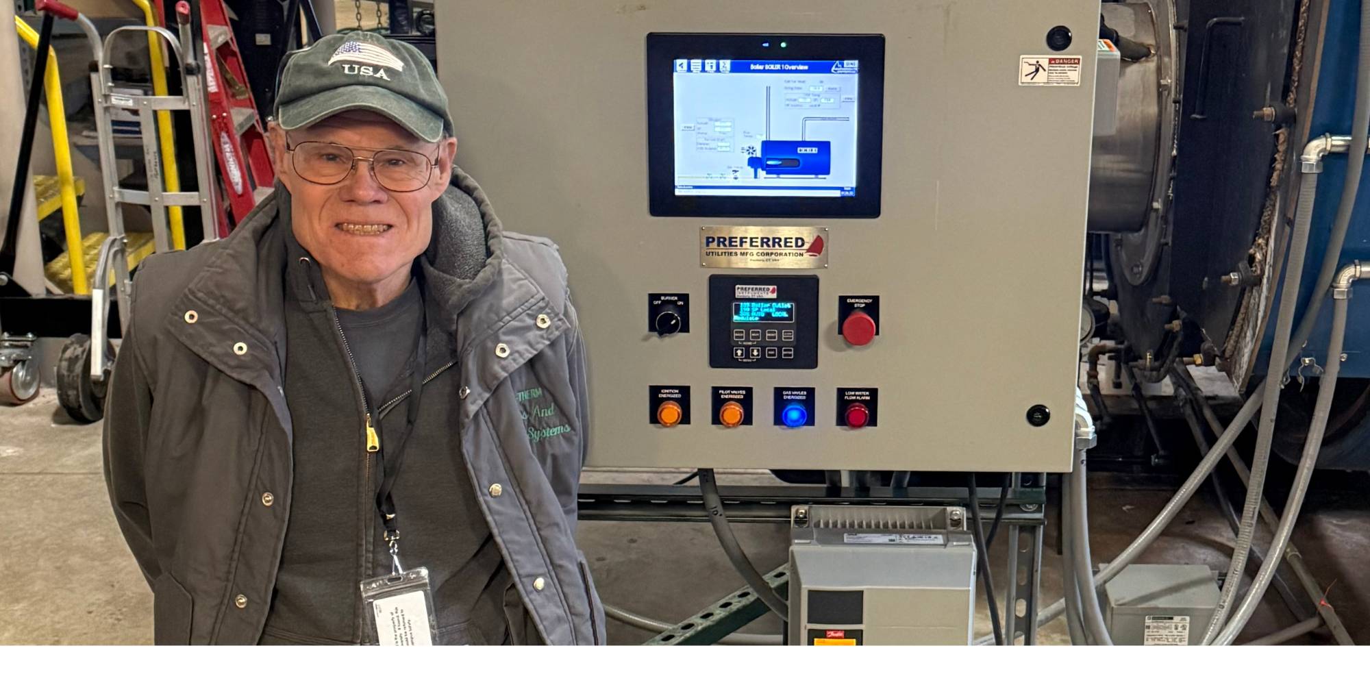 John Wiesehan standing in front of a boiler at Calvin University