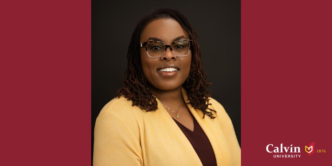 Photo of La'Leatha Spillers smiling, wearing yellow sweater and maroon shirt