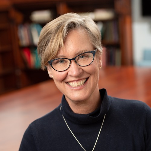 Nancy Jacobs in a black turtleneck smiling