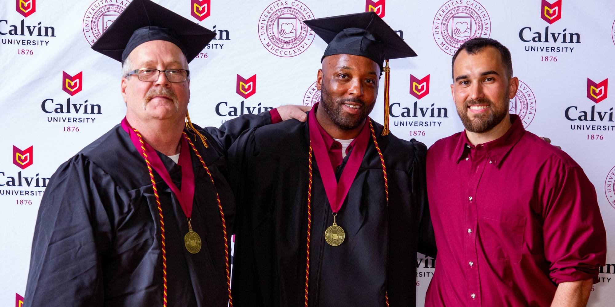 Three Calvin University graduates from the Calvin Prison Initiative's Class of 2026