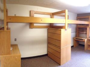 Two individual lofted singles on legs, sharing the center support of two stacked dressers.