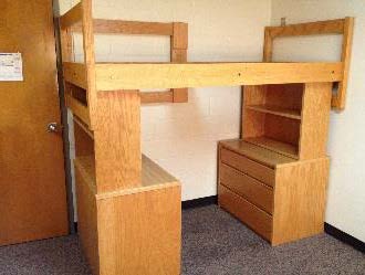 A single bed nested over combinations of desk/dresser and bookcases. 
