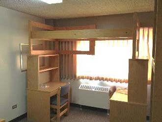 A desk with shelf and a dresser with shelf facing inward toward each other, with a bed stacked on top.