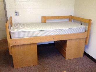 A bed stacked on two dressers.
