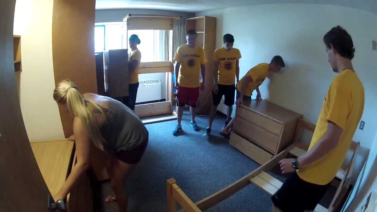 A sped-up video showing a group of people arranging and rearranging the stackable beds, desks, dressers, and shelves in the Calvin dorm rooms.