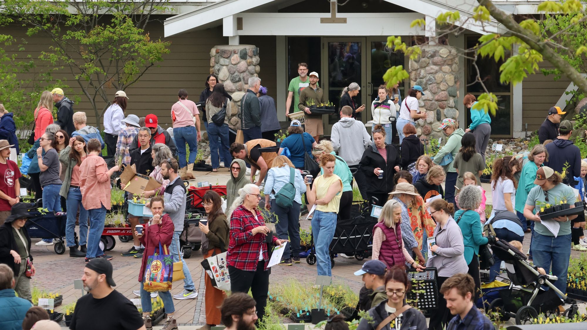 view of plant sale shoppers in front of bunker interpretive center