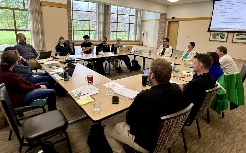 Faculty in a training session with the De Vries Institute